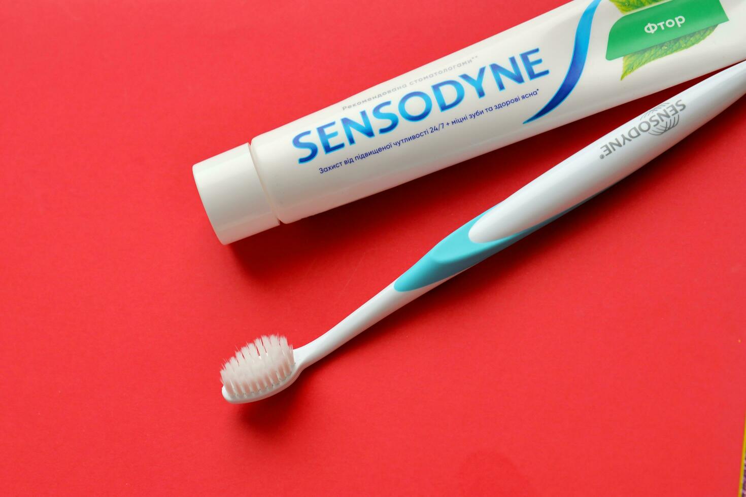 KYIV, UKRAINE - MAY 4, 2022 Sensodyne fluorine or fluor is a daily fluoride toothpaste photo