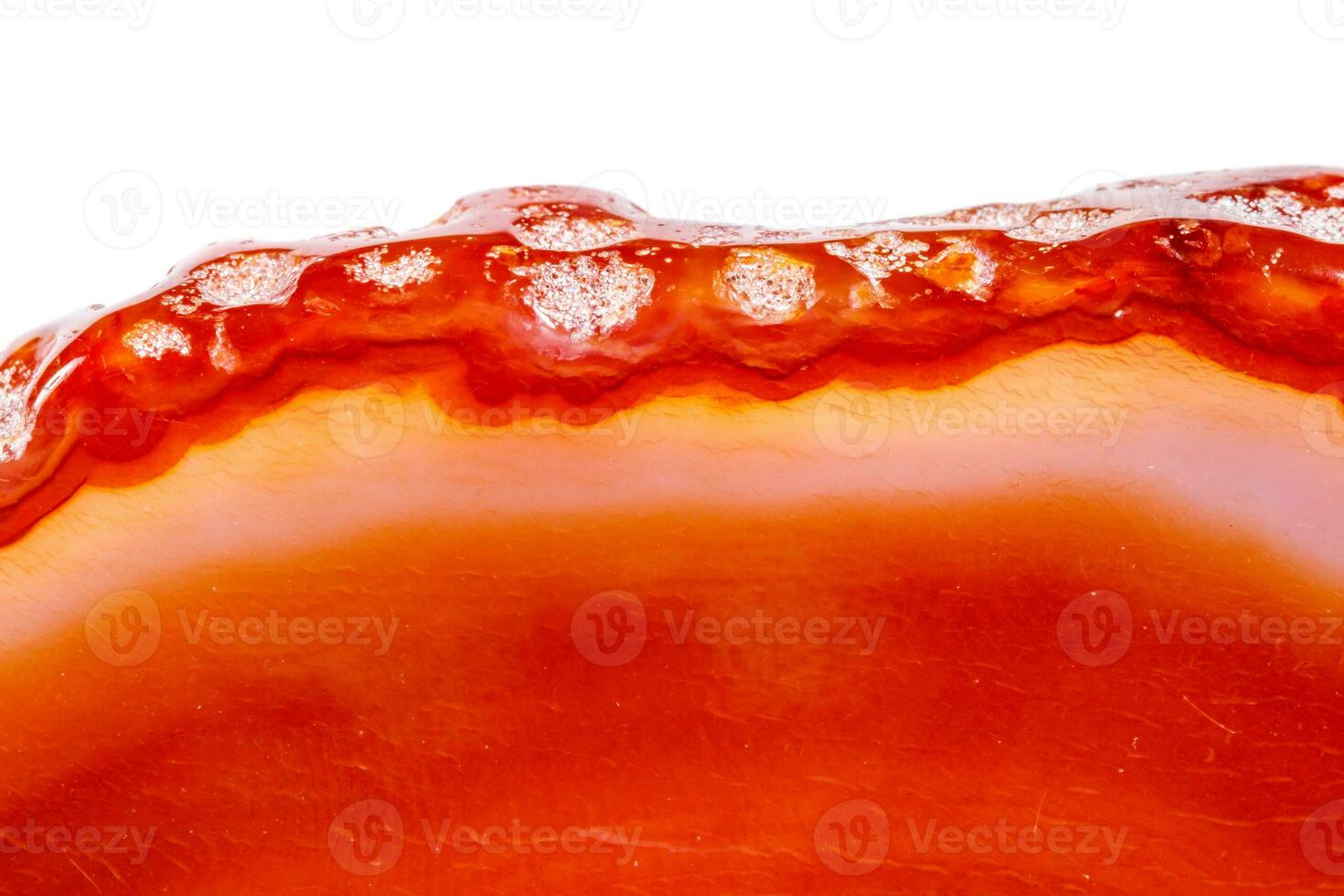 Macro mineral orange agate in crystals on white background photo