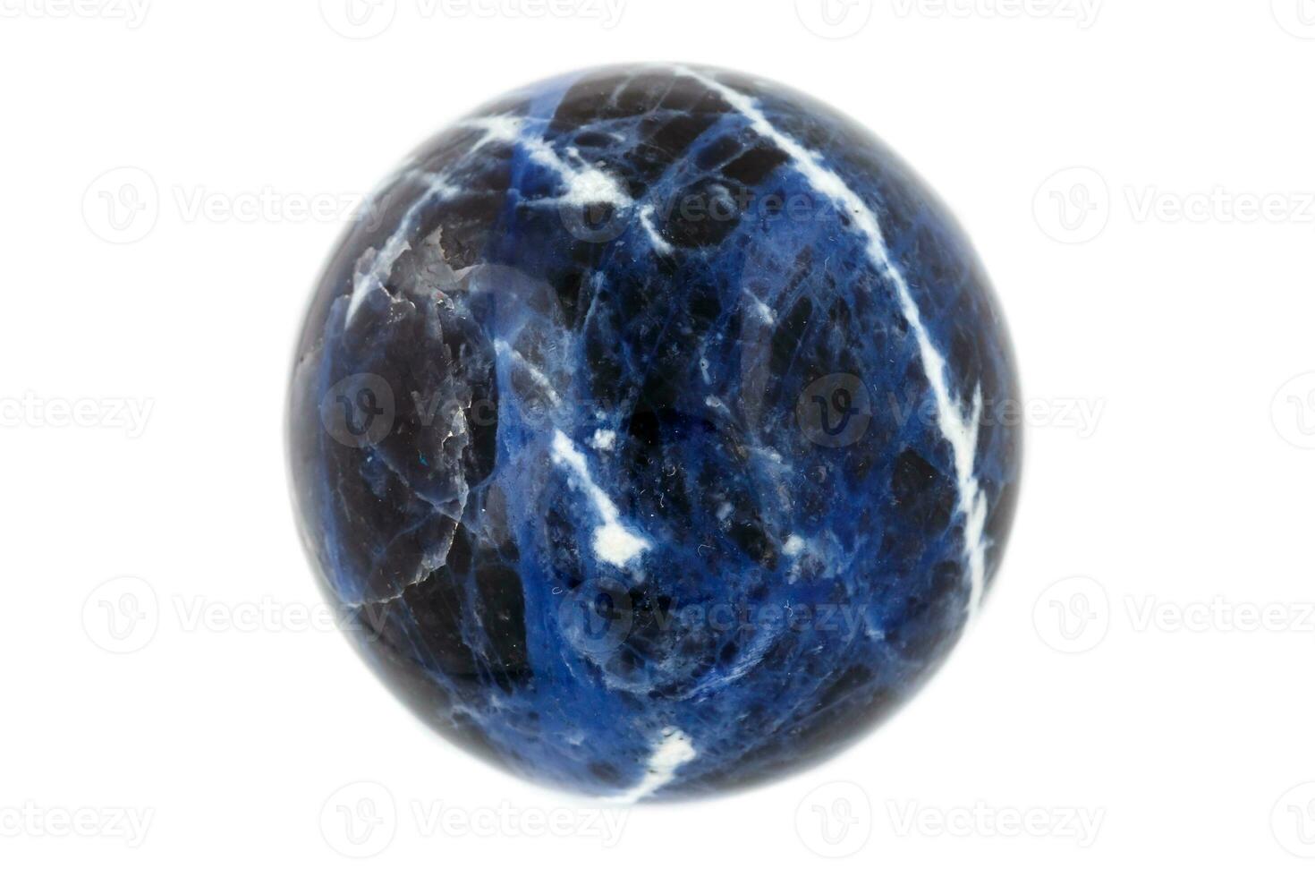 Macro mineral stone Sodalite ball on white background photo