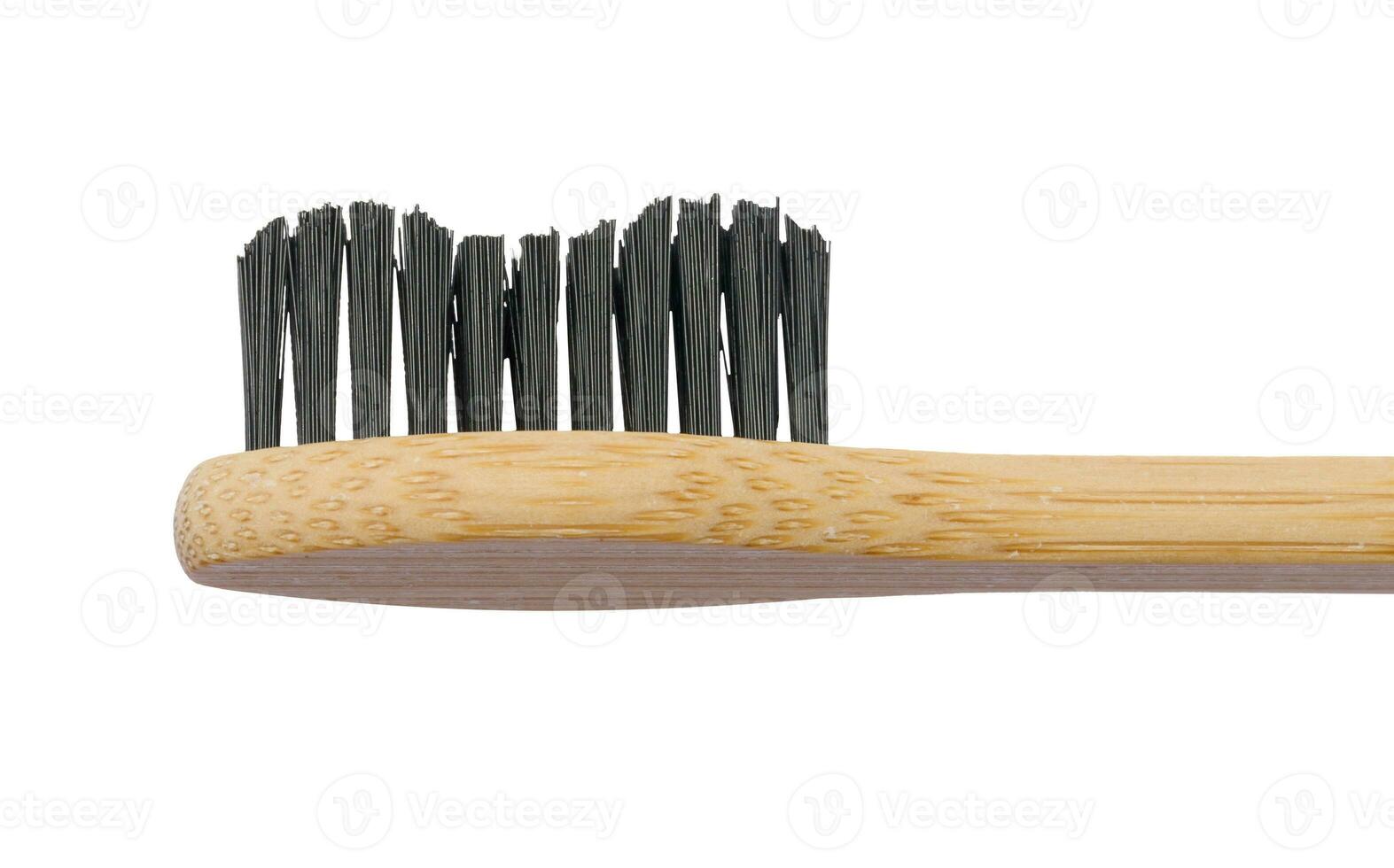 Wooden toothbrush on white isolated background, oral hygiene photo
