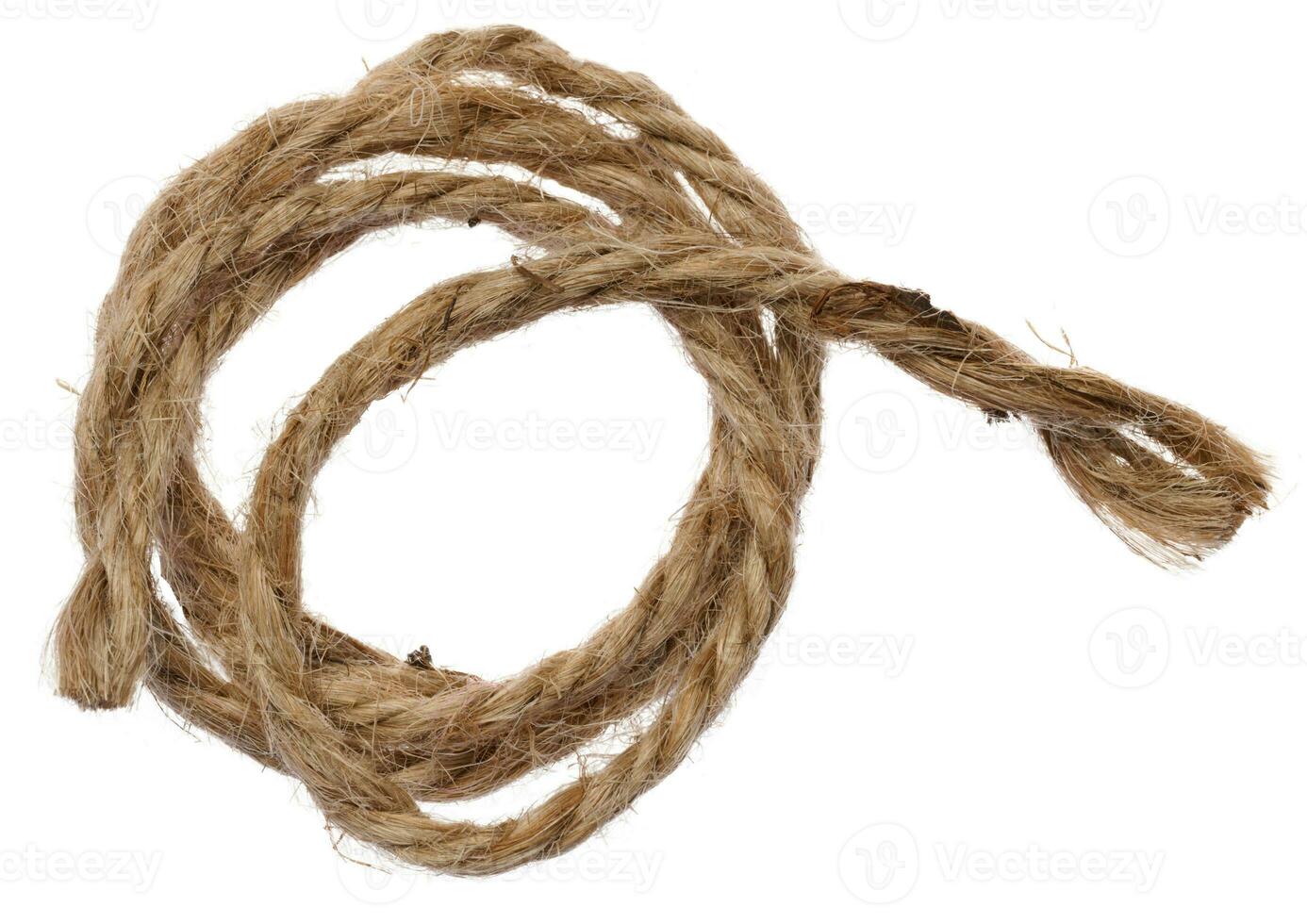 Brown twine rope on a white isolated background, top view. photo