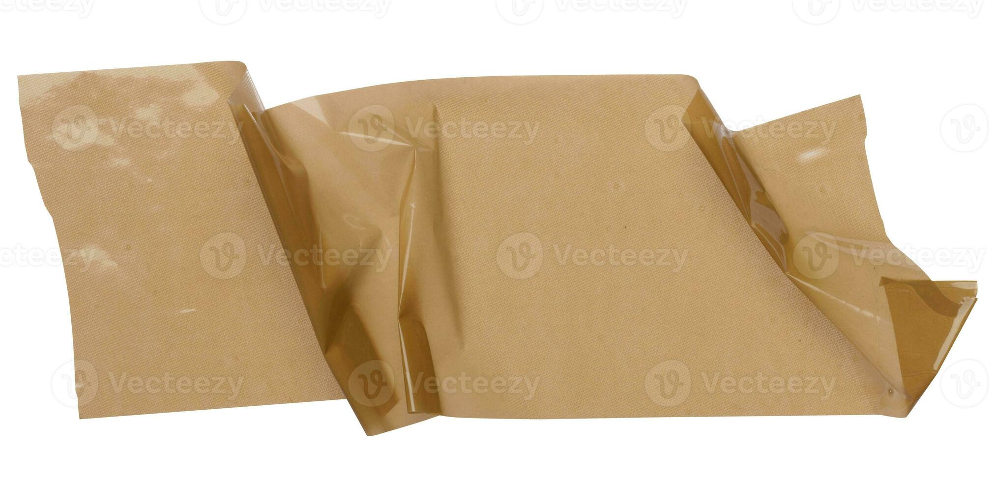 Crumpled piece of brown adhesive cellophane tape, packaging material photo