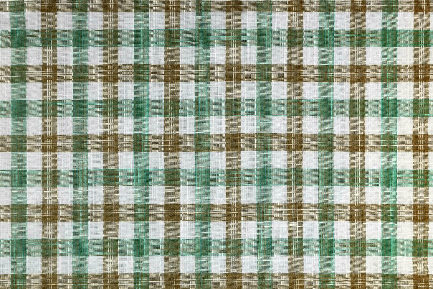 Green and brown checkered texture fabric, tartan pattern background. photo
