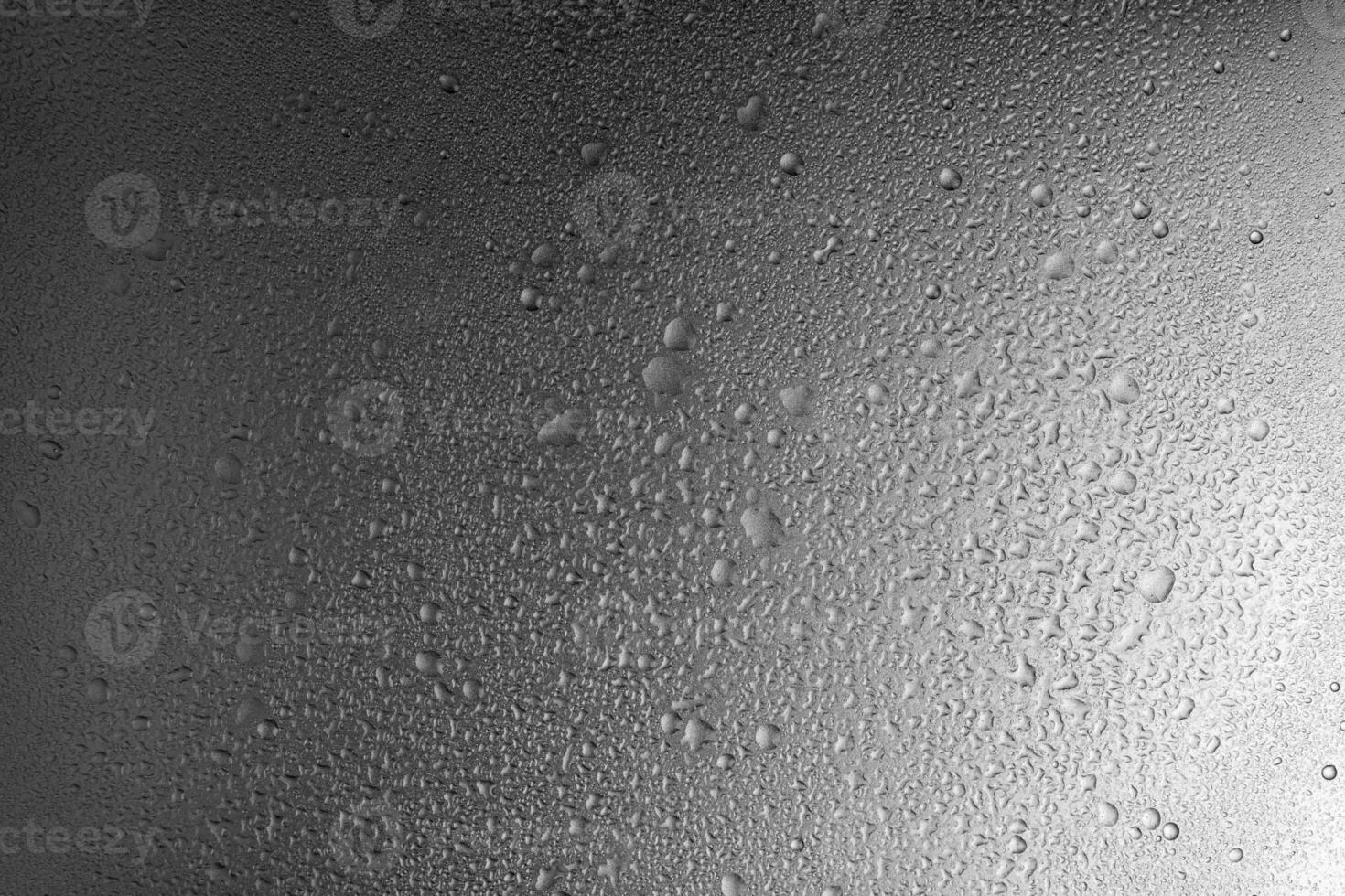 Water drops on gray metal background texture with smooth transition of lighting photo