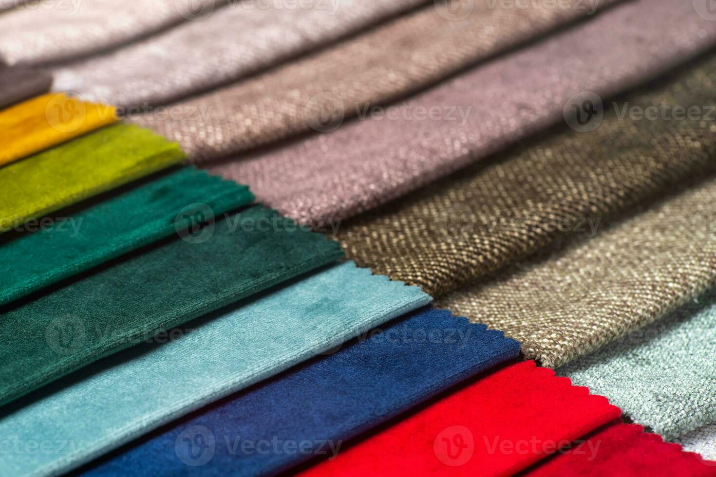 Multi colored set of upholstery fabric samples for selection, collection of textile swatches photo