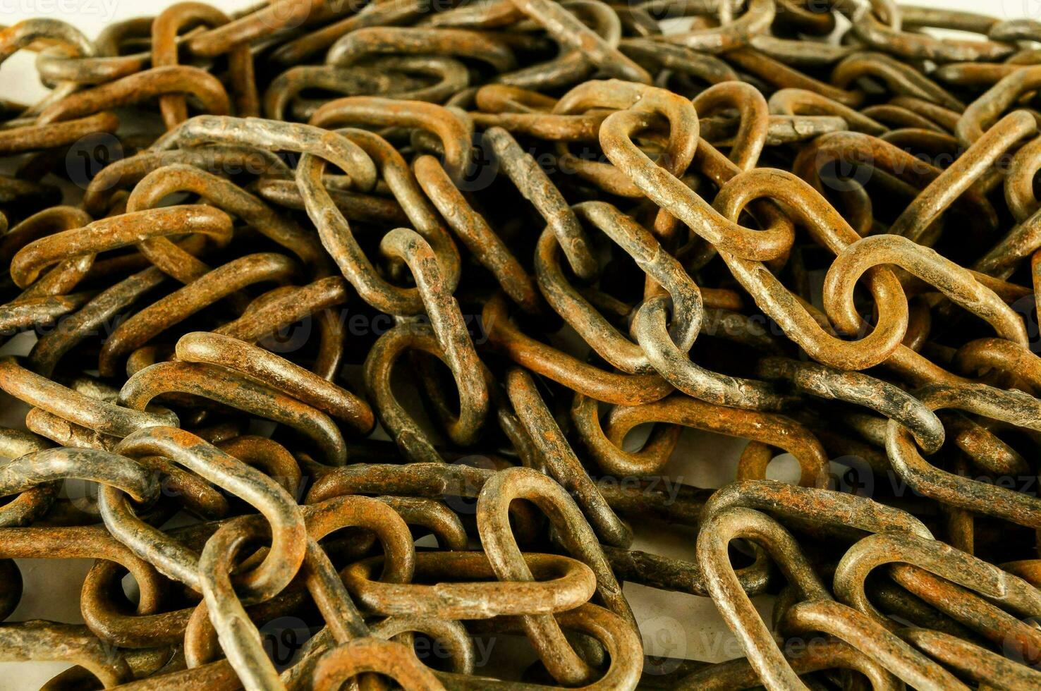 a pile of old rusty chain links photo