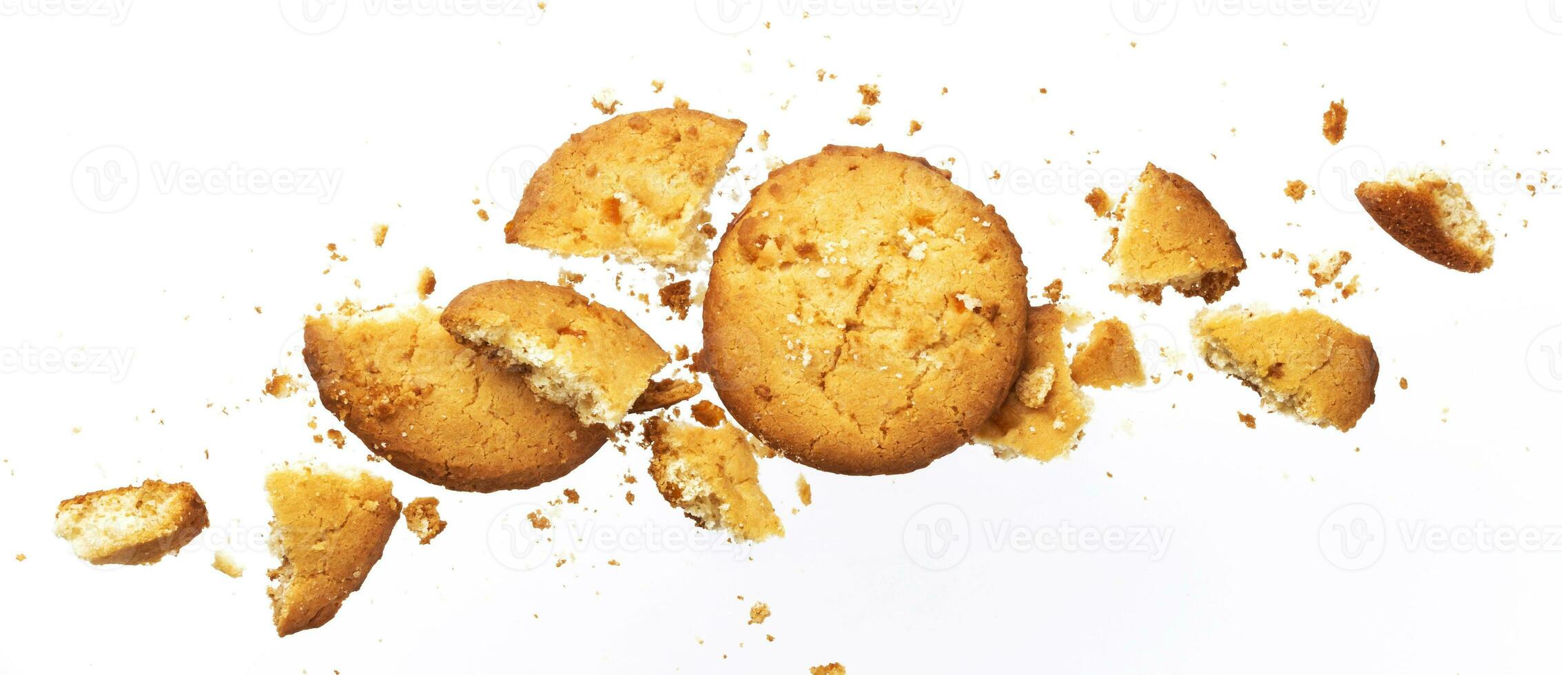 Broken oatmeal cookies isolated on white background photo