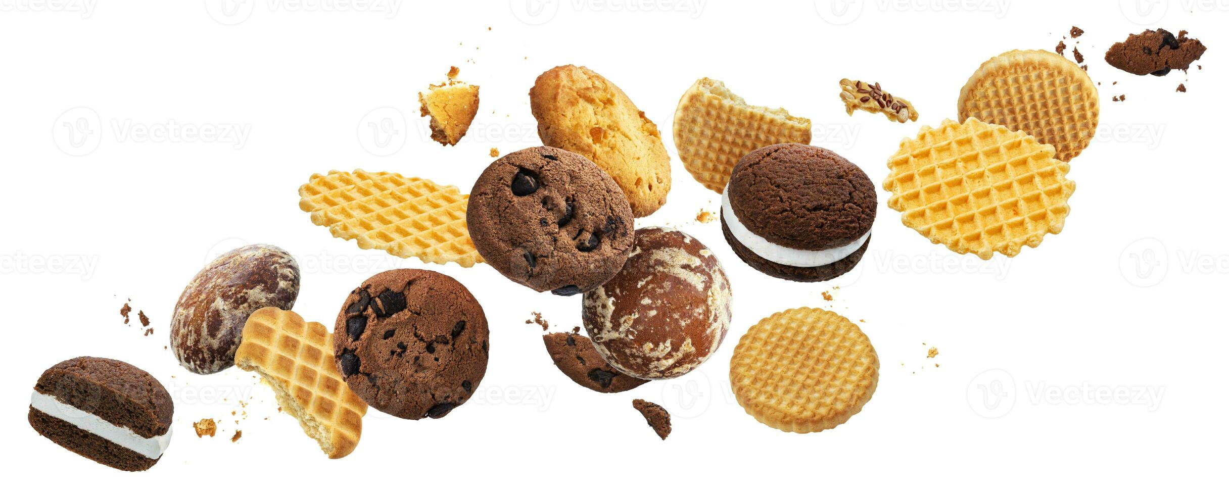 Falling cakes, cookies, crackers, waffles isolated on white background photo
