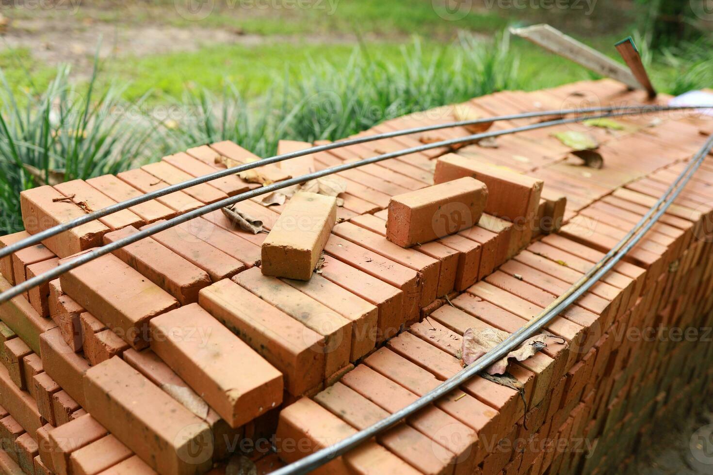 Pallet a red brick building material stack of new red bricks for construction. photo