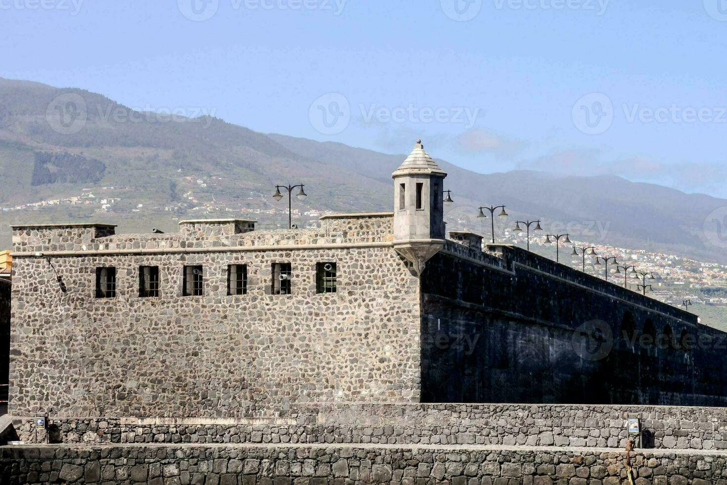 a large stone building with high walls photo