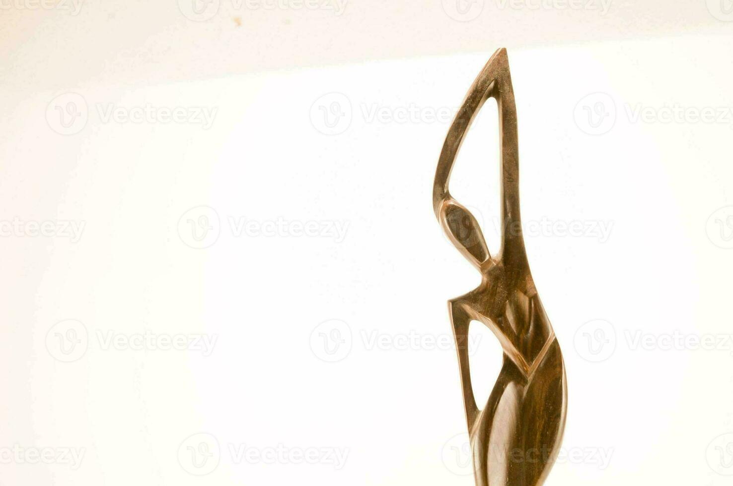a bronze sculpture of a woman photo