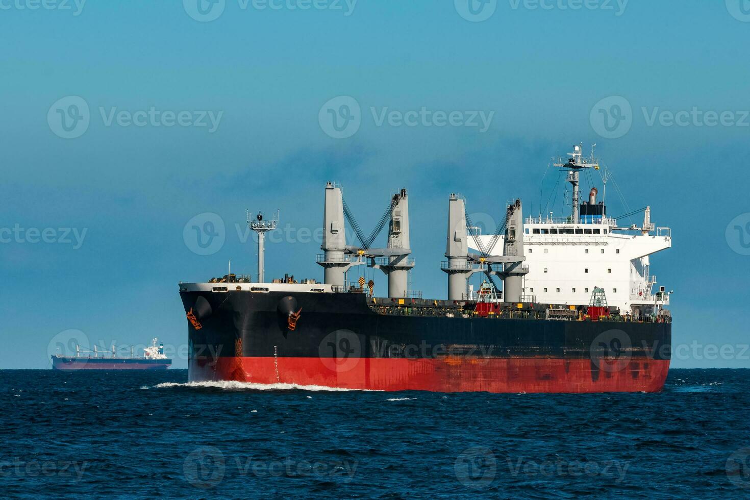 Black bulker ship. Logistics and merchandise transportations photo