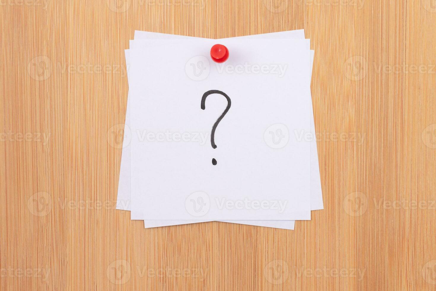 White Sticky Notes with Question Mark Pinned to the Wooden Message Board. To Do List Reminder in the Office. Memo Note at Work photo