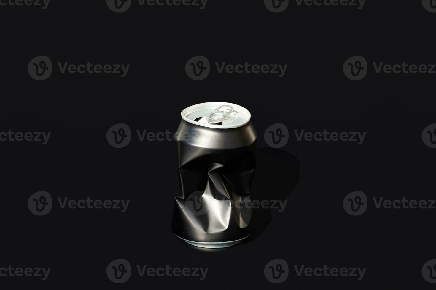 One aluminum creased drinking can. Sorting garbage concept. photo