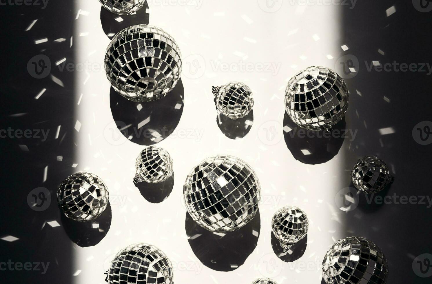 Sparkle silver disco balls flat lay. Festive retro party background. photo