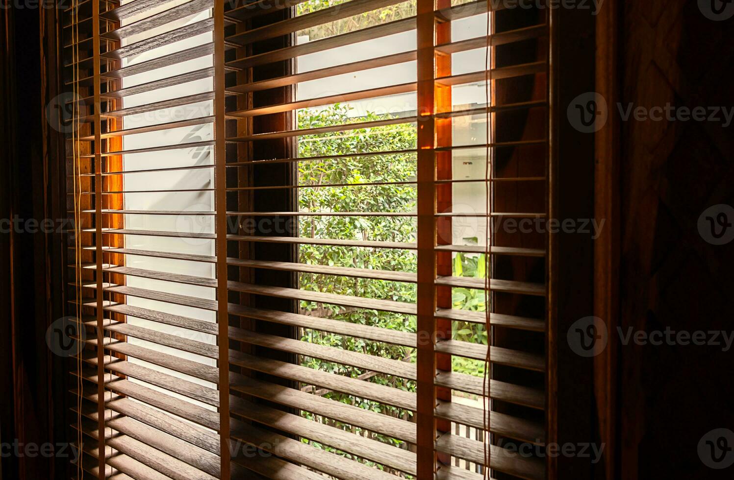 Open wooden window blinds, close up. photo