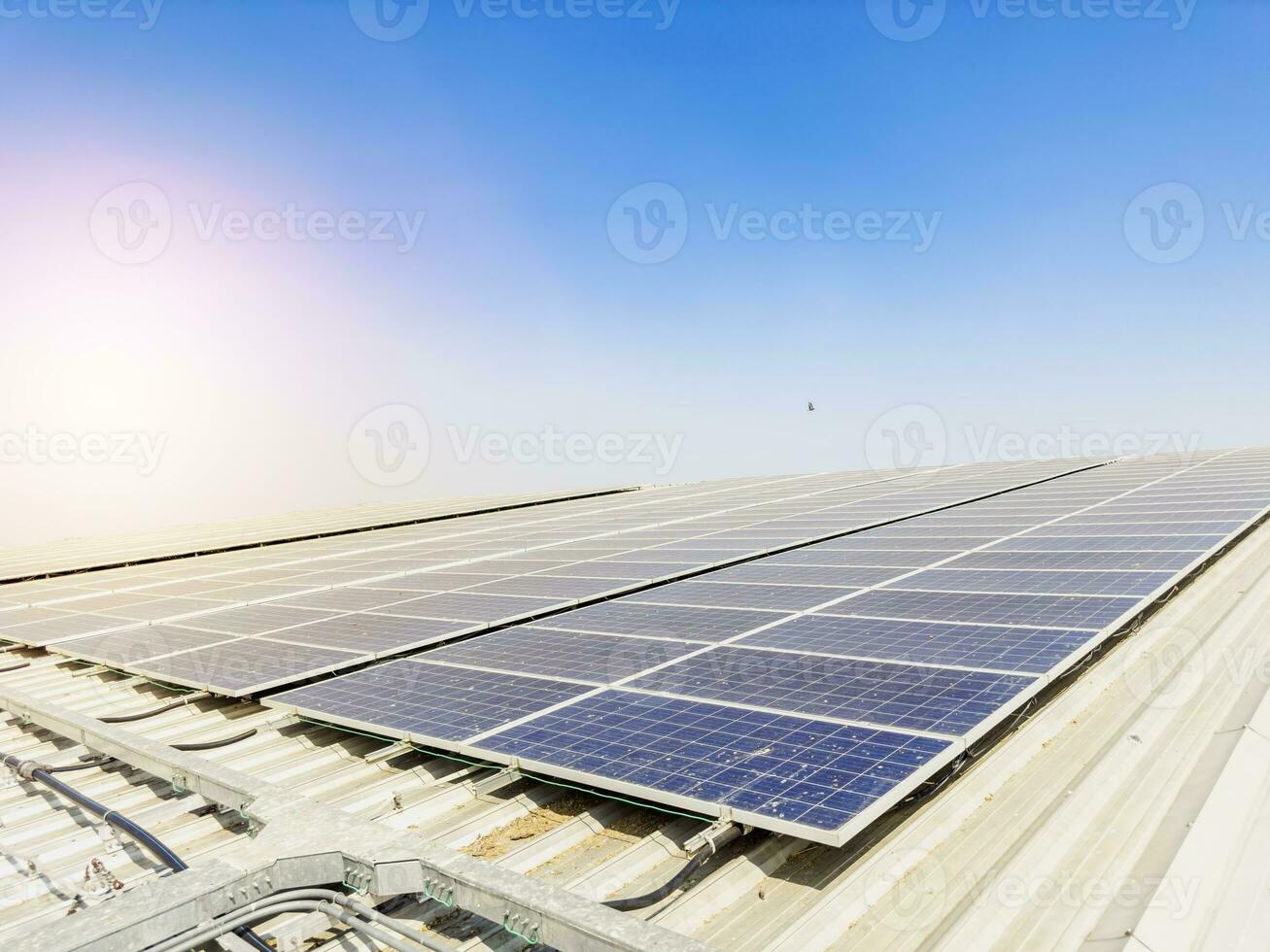 Solar panels installed on the roof generate energy from the sun. Sunlight is clean energy. and environment The solar panels are dirty and old. photo