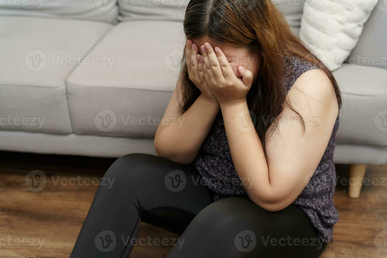 Sad Overweight plus size woman thinking about problems on sofa upset girl feeling lonely and sad from bad relationship or Depressed woman disorder mental health photo