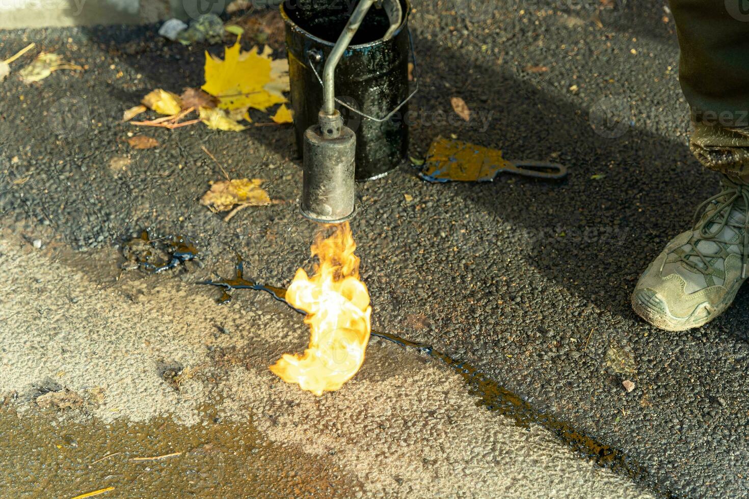 Professional Asphalt Crack Sealing with Mastic and Fiery Gas Burner Method photo