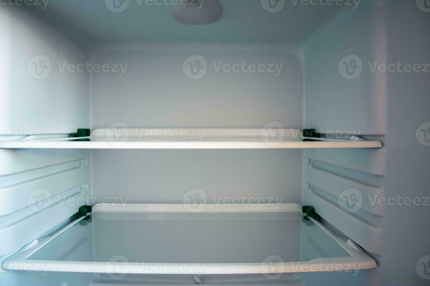Empty Glass Shelves of the New Refrigerator Interior Organizer photo