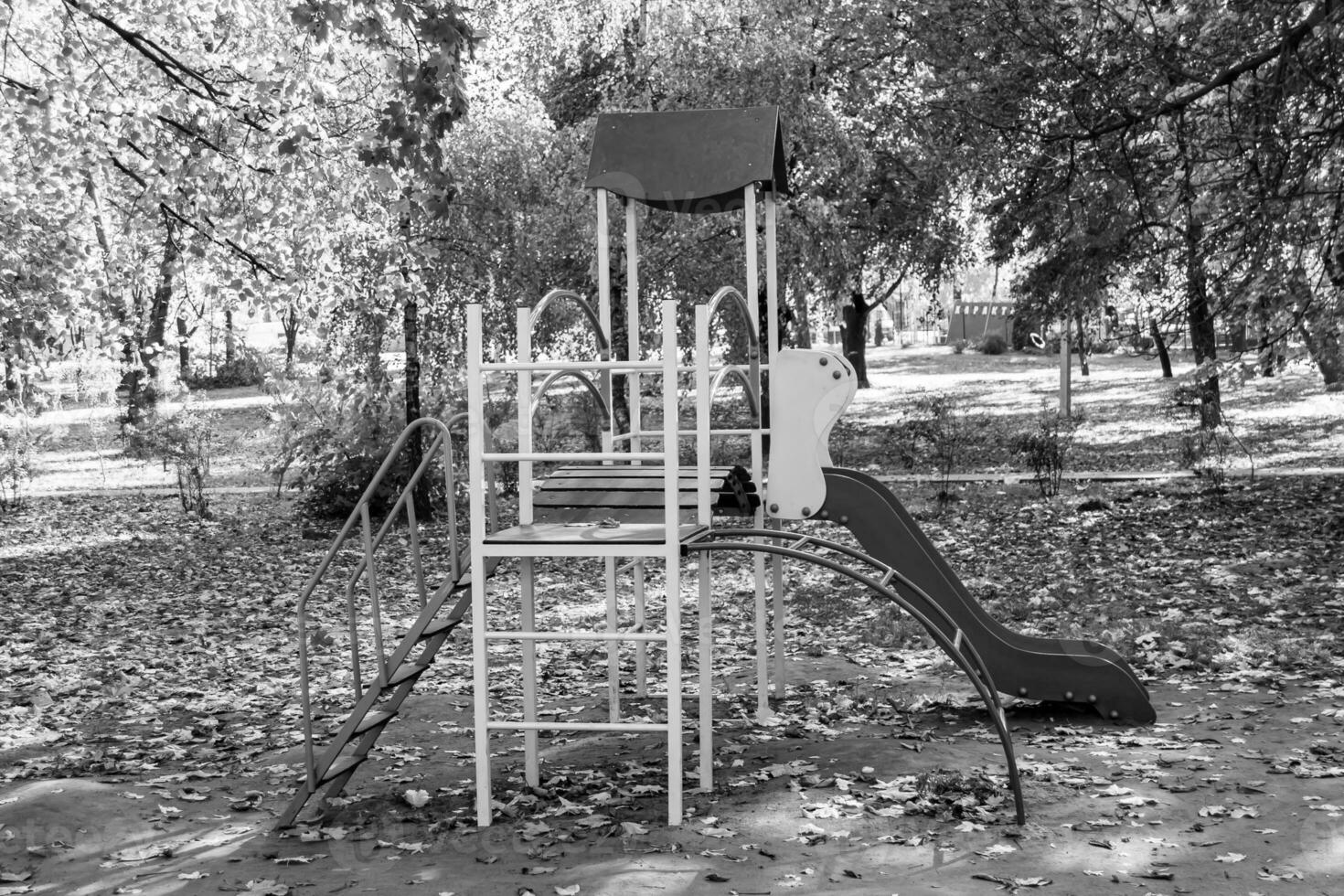 Photography on theme empty playground with metal slide for kids photo