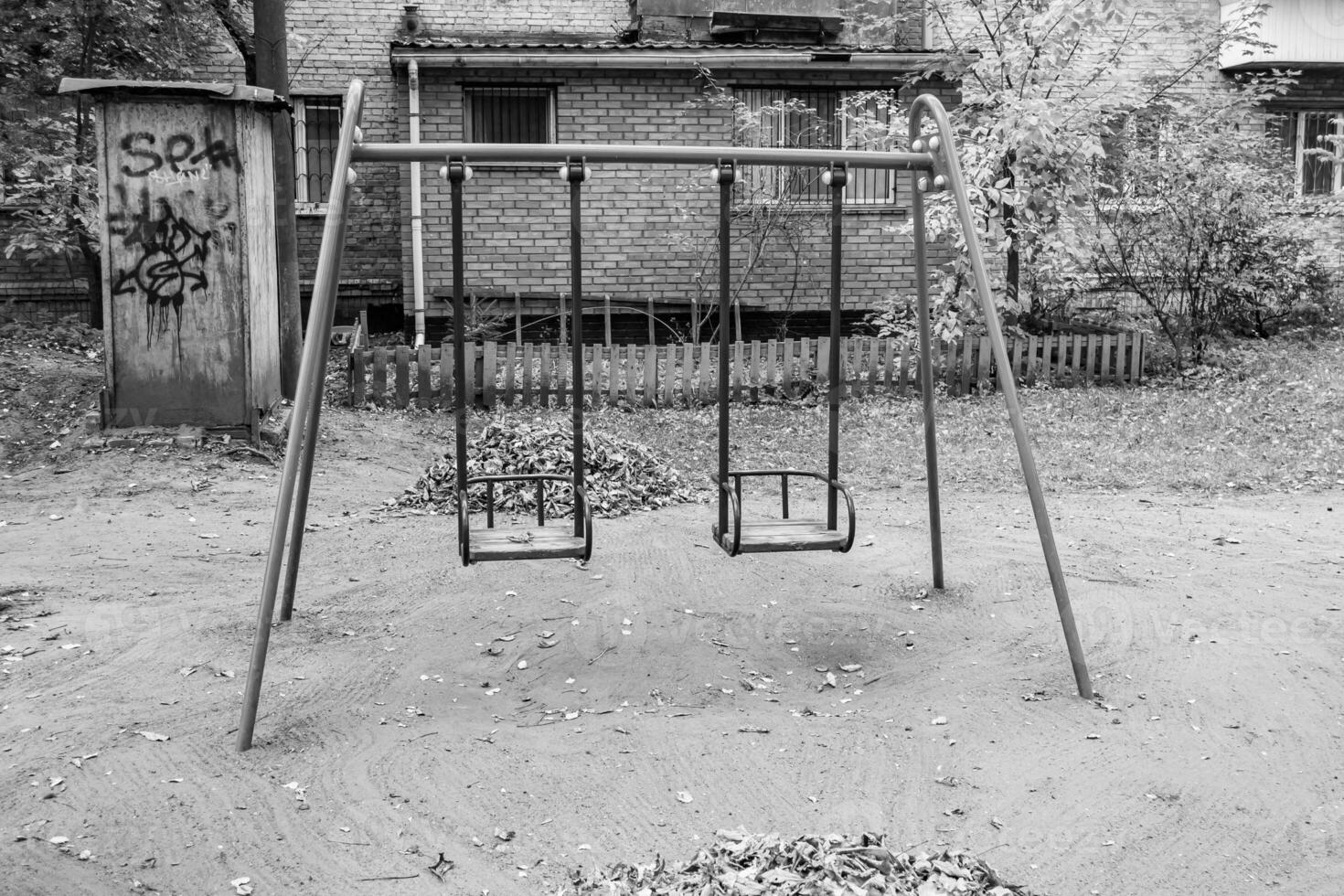 Photography on theme empty playground with metal swing for kids photo