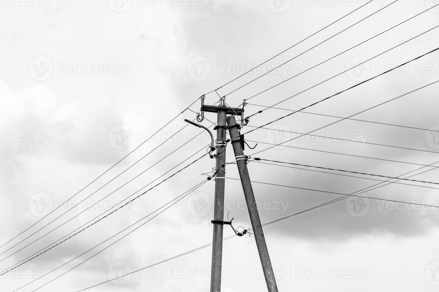 Power electric pole with line wire on light background close up photo