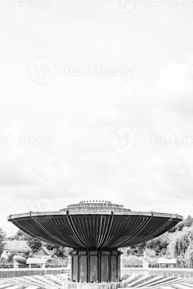 Photography on theme beautiful old fountain without water under clear sky photo