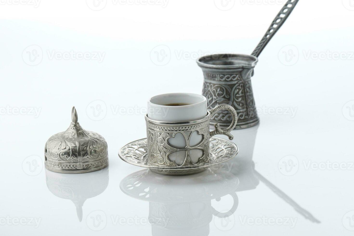 Turkish Coffee in Metal Silver Traditional Cup. photo