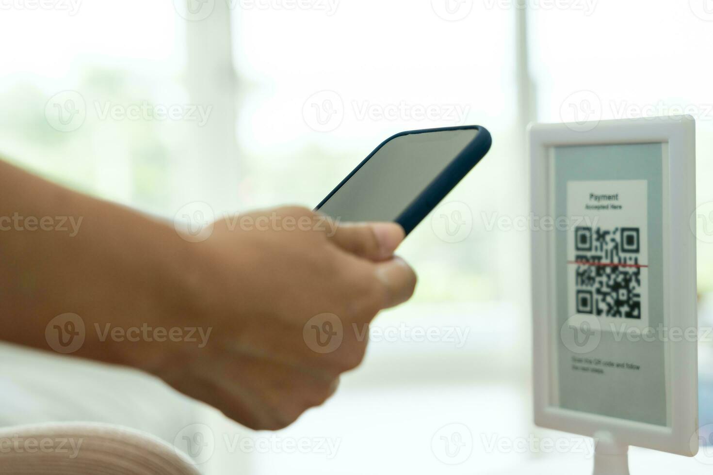 Modern woman use phone to scan barcode or QR codes to pay credit card bill after receive document invoice. payment, receive, paying electricity, digital payments without money, technology, scanning photo