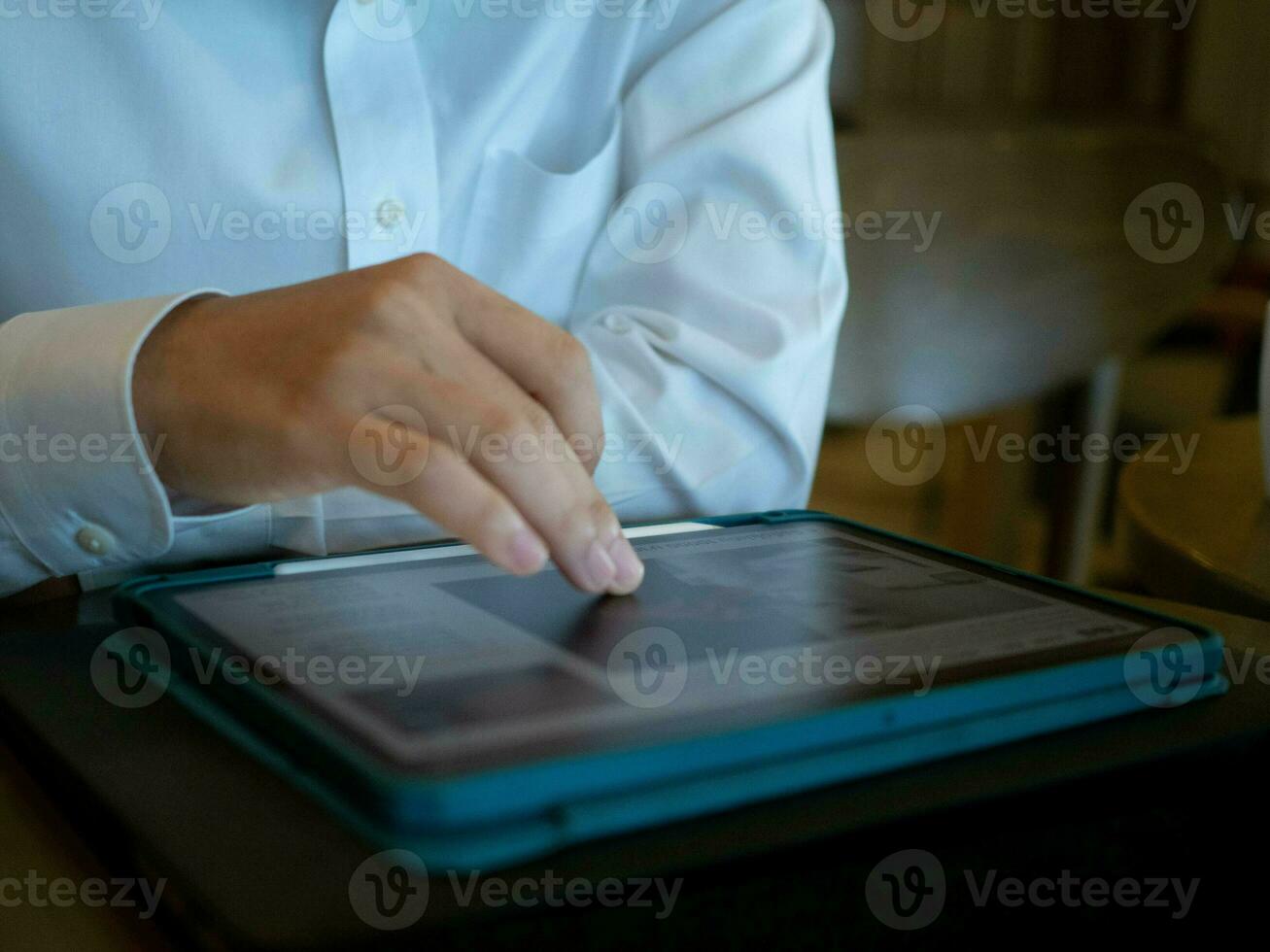 pointing finer cheerful person people business hand arm touchscreen tablet notebook computer smartphone mobile news technology digital wireless online cyberspace information document gesture media photo
