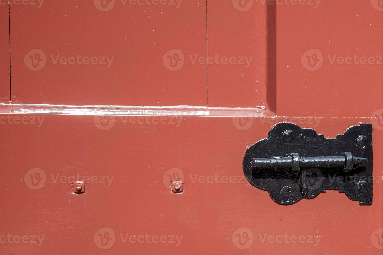 part of a brown window drawer with lock photo