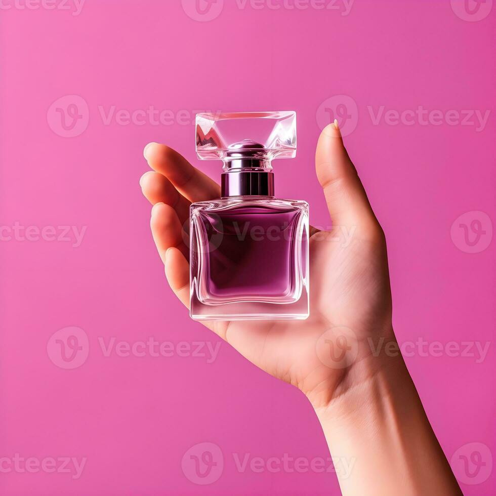 AI generated Hand Holding Elegant Perfume Bottle on Pink Background photo