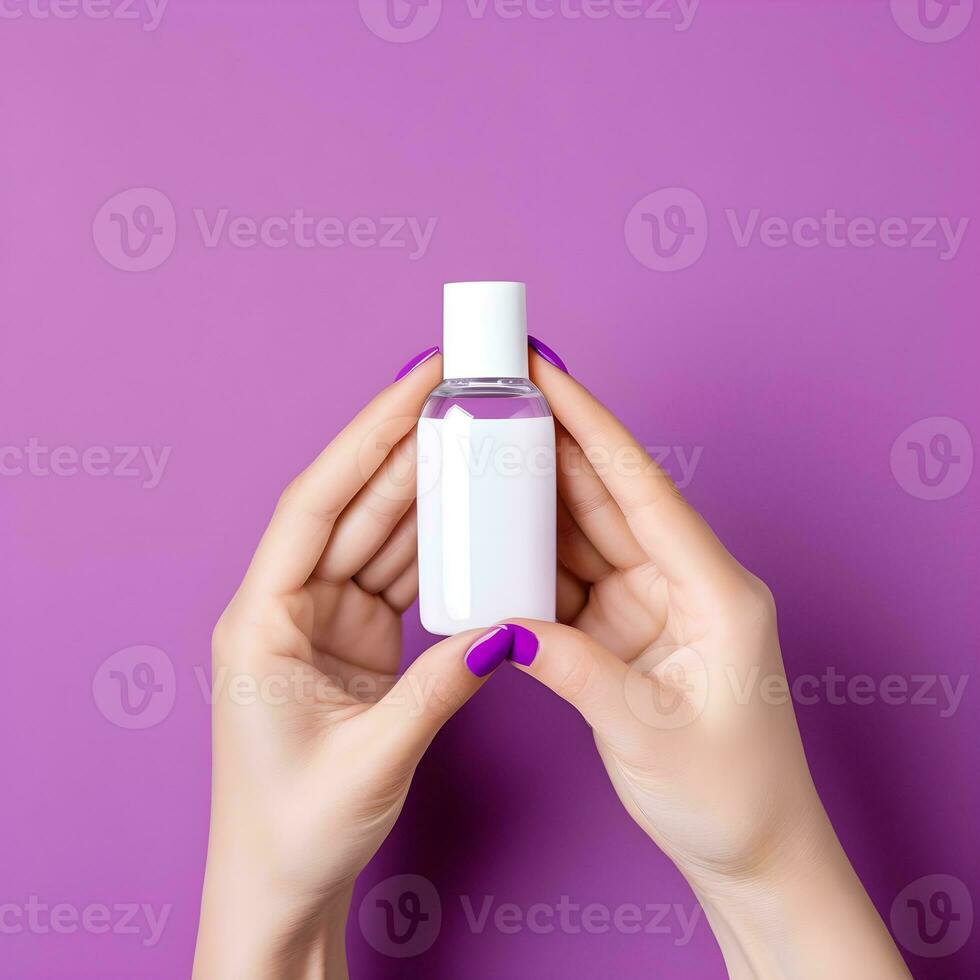 AI generated Hands Holding a Blank Nail Polish Bottle on Purple Background photo