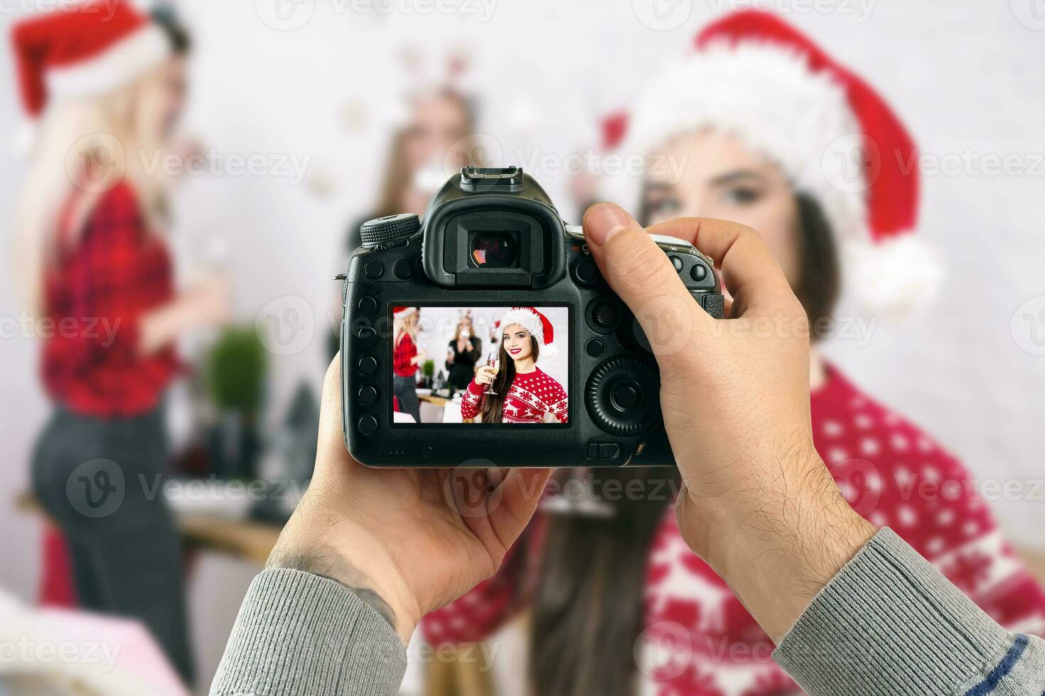 Digital single-lens reflex camera in hands. Man photographer makes photos. Male hands hold the camera close-up photo