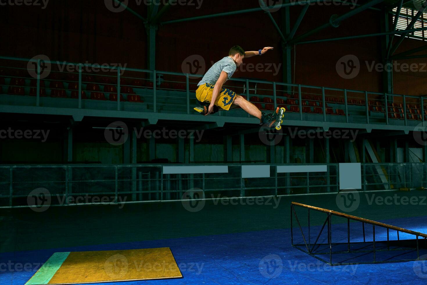 The man performs a trick. Jump. Indoor training photo