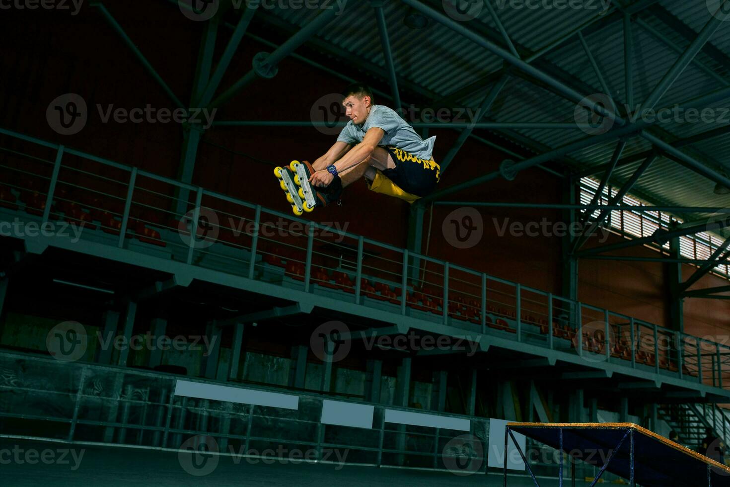 The man performs a trick. Jump. Indoor training photo