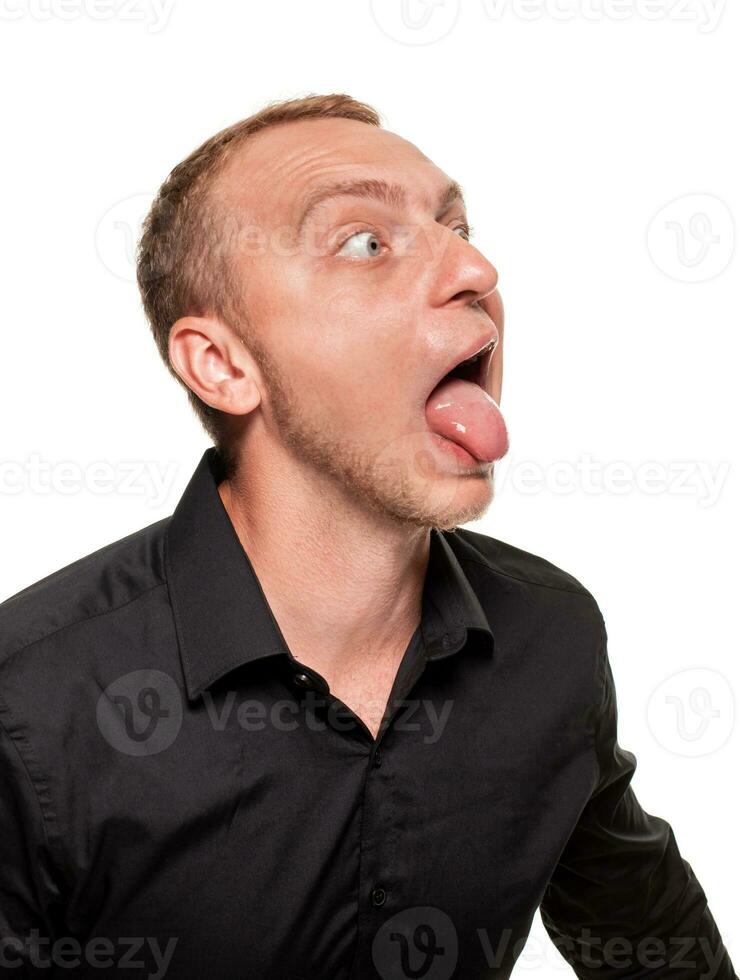 Handsome young blond man in a black shirt, isolated on a white background photo