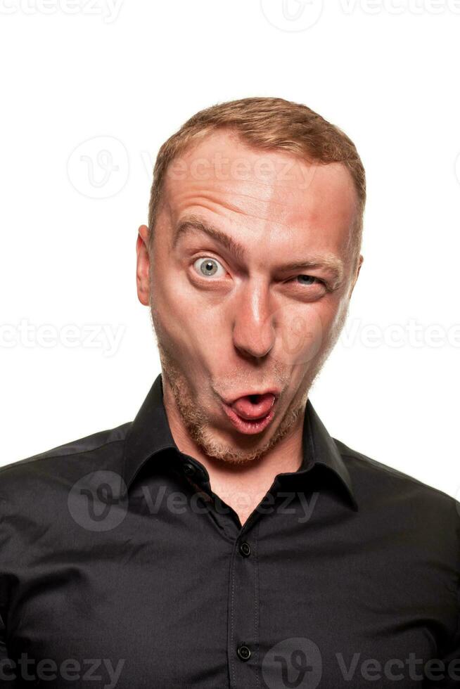 Handsome young blond man in a black shirt, isolated on a white background photo