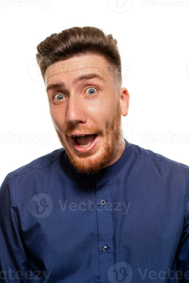 Attractive young man wearing blue shirt, isolated over a white background. photo