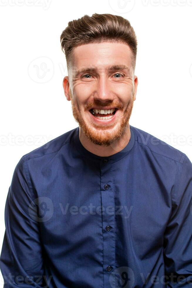 Attractive young man wearing blue shirt, isolated over a white background. photo