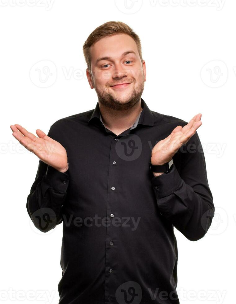 Handsome man in a black shirt, isolated on a white background, feeling great and comfortable. photo