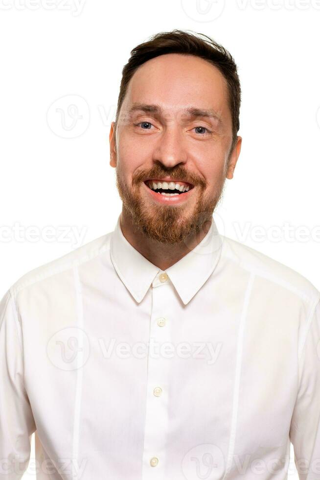 Stylish bearded business man smiling to camera, having pleased expression and cheerful look. photo
