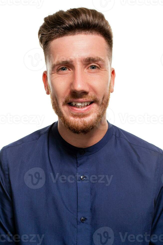 Attractive young man wearing blue shirt, isolated over a white background. photo