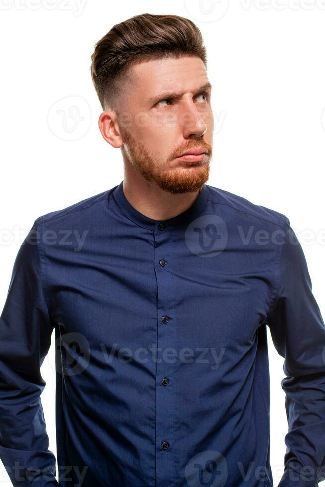 Attractive young man wearing blue shirt, isolated over a white background. photo