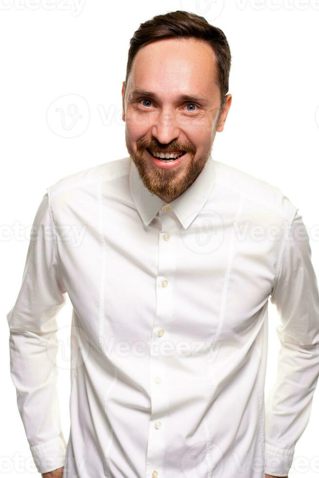 Stylish bearded business man smiling to camera, having pleased expression and cheerful look. photo