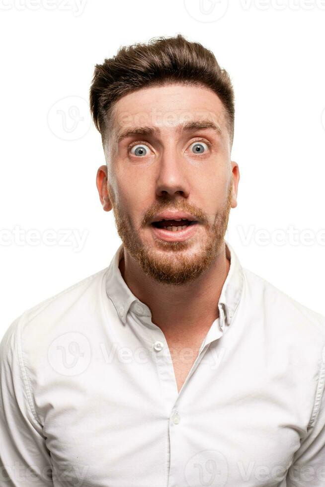 Studio photo of a good-looking man in a white shirt, isolated over a white background