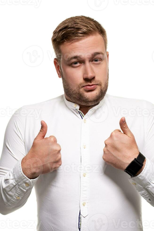 Close up horizontal portrait of a handsome man with a beard, stylish haircut, wearing a white shirt, isolated on a white background photo