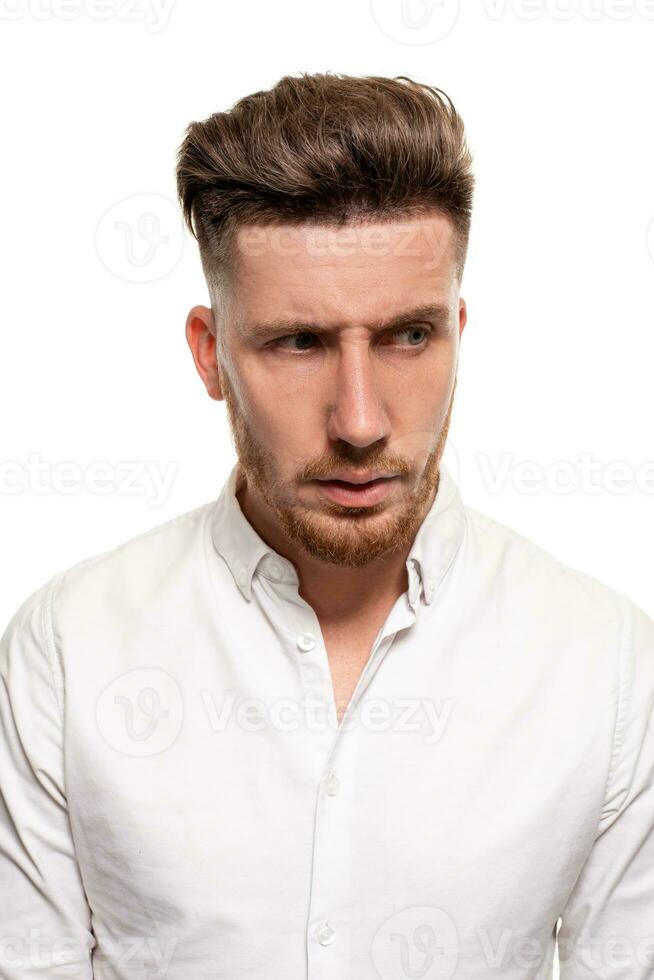 Studio photo of a good-looking man in a white shirt, isolated over a white background