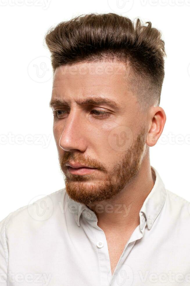 Studio photo of a good-looking man in a white shirt, isolated over a white background